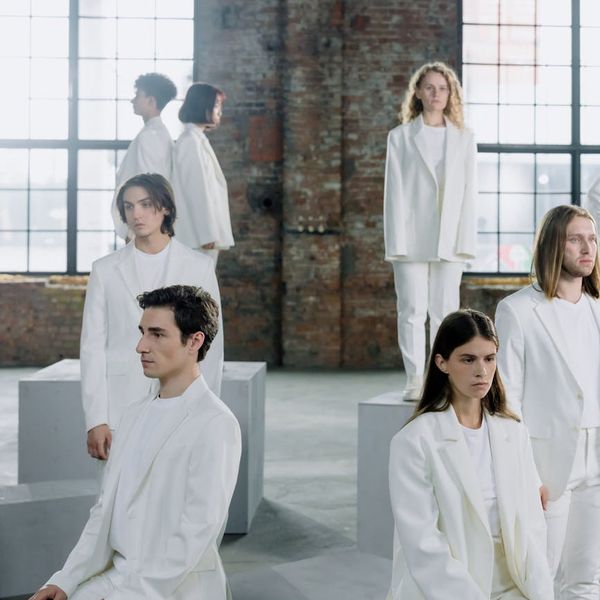 A group of people sitting in a meditation pose, finding collective calm.